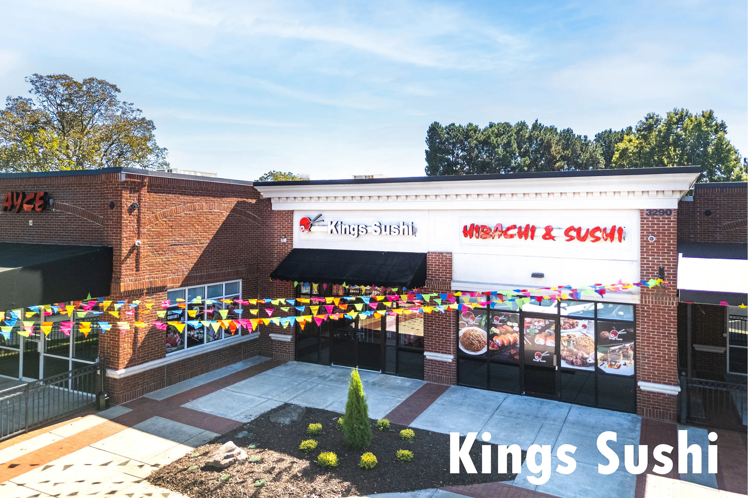 Bright exterior with festive banners at Kings Sushi, a Japanese Restaurant in Buford