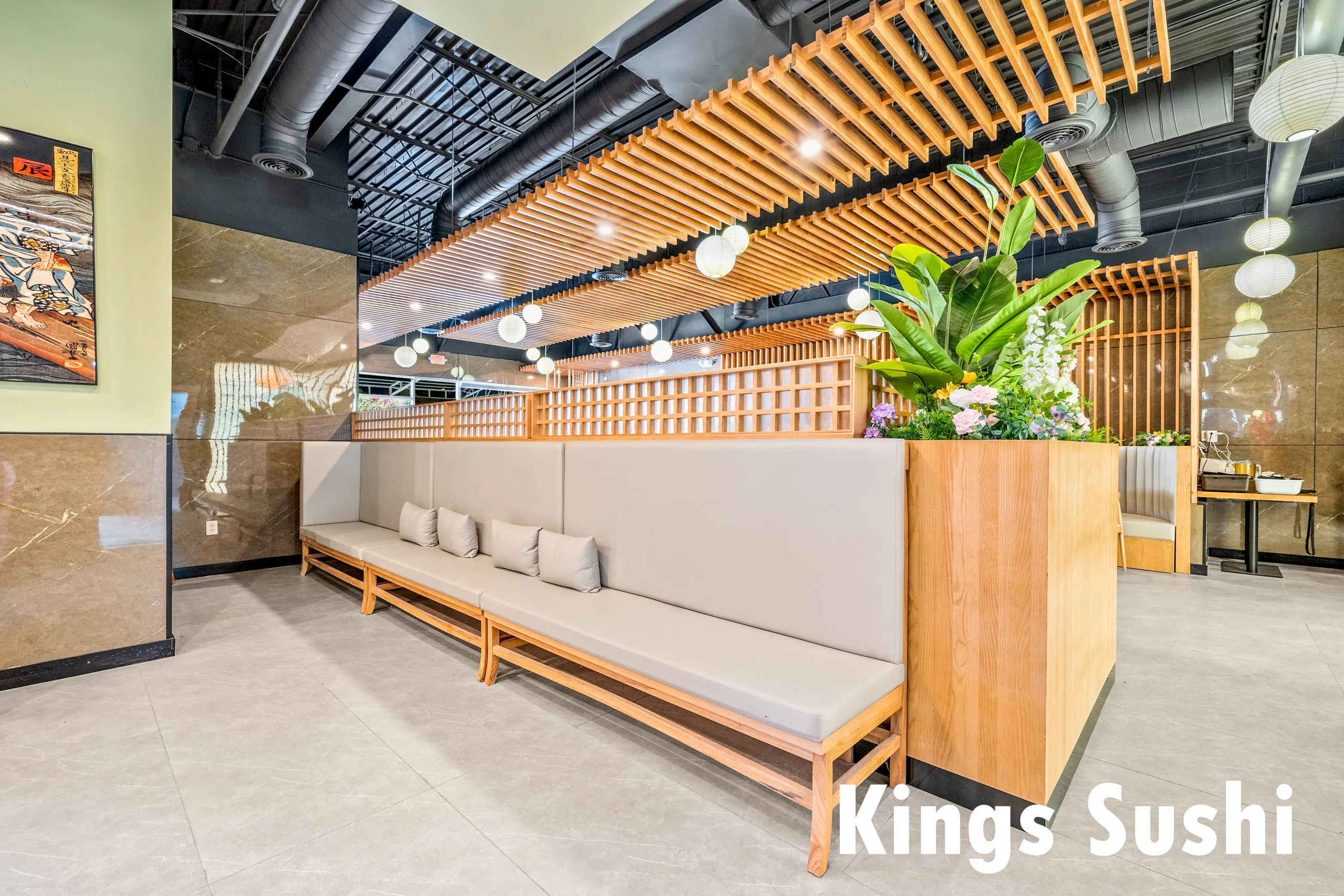 Cozy booth seating with greenery at Kings Sushi, a Japanese Restaurant in Buford